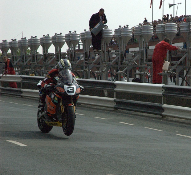 It is hoped John McGuinness, pictured on his way to victory in the 2007 Senior TT, will attend the NEC Motorcycle and Scooter Show